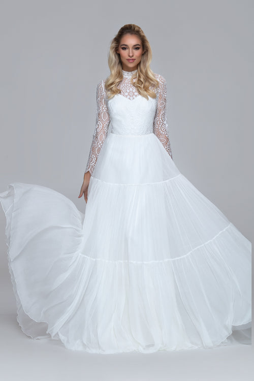 romantic boho wedding dress. Lace top with turtle neck and closed back with drop split. Layered silk chiffon skirt.