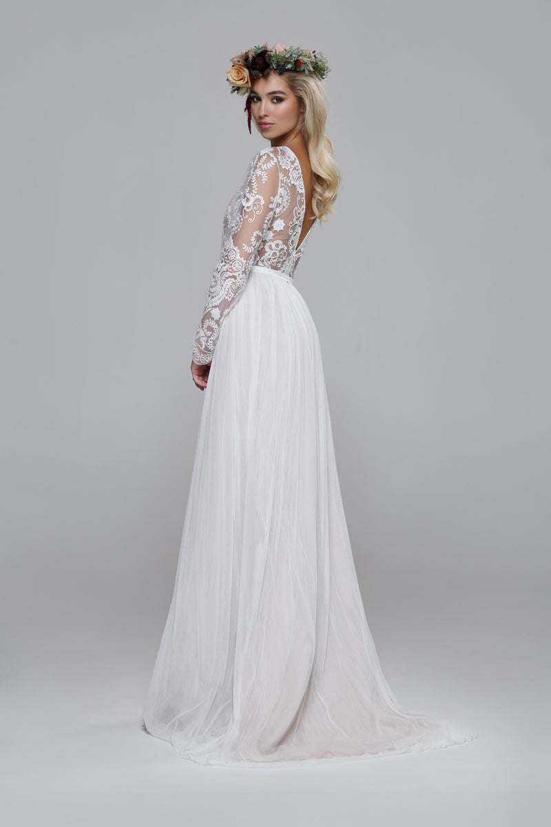 Shiny wedding dress. Beaded top with silk tulle skirt. Boat neckline open back.