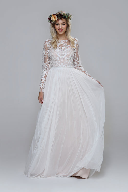 Shiny wedding dress. Beaded top with silk tulle skirt. Boat neckline open back.