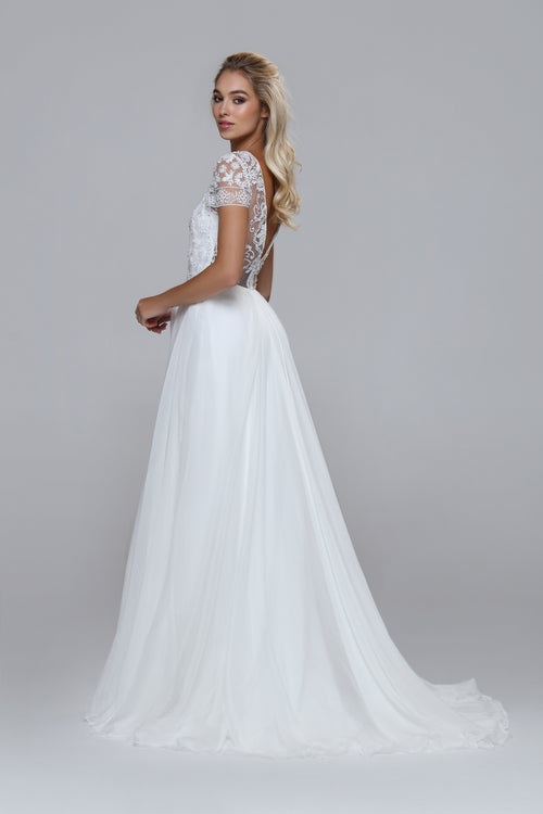 Wedding dress with beaded top and silk chiffon skirt. Boat neckline with V-back.